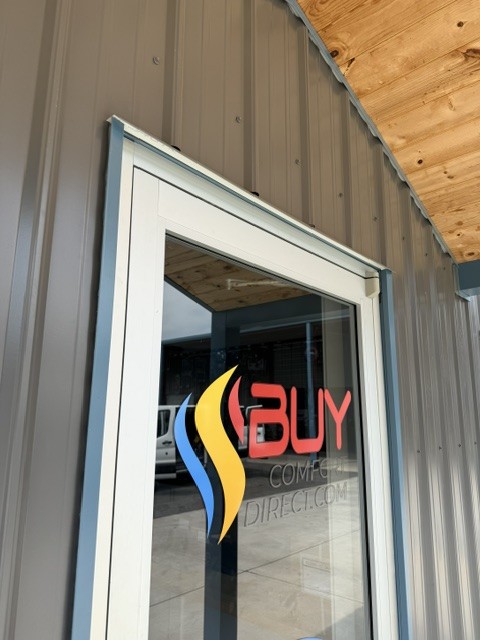 Buy Comfort Direct logo on the front door of our Winder, Georgia location